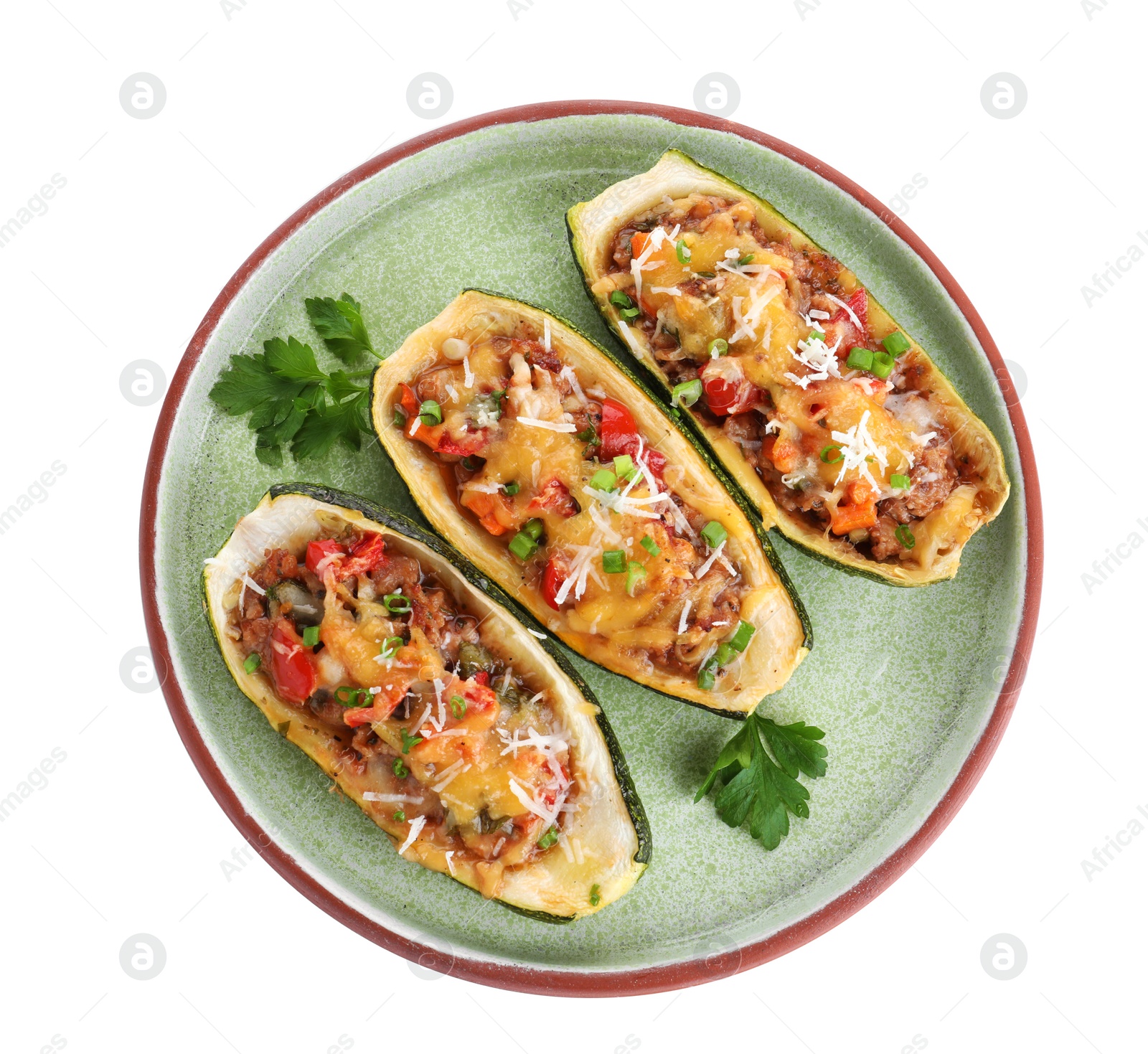 Photo of Plate of delicious stuffed zucchini on white background, top view