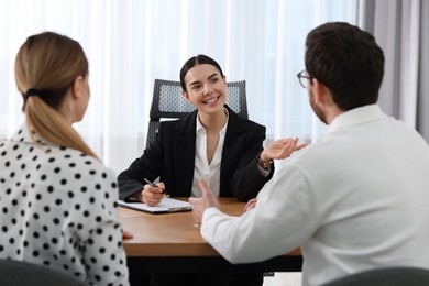 Couple having meeting with lawyer in office