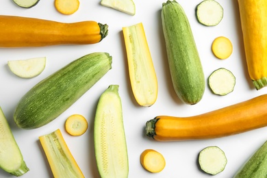 Photo of Fresh ripe zucchinis on white background, top view