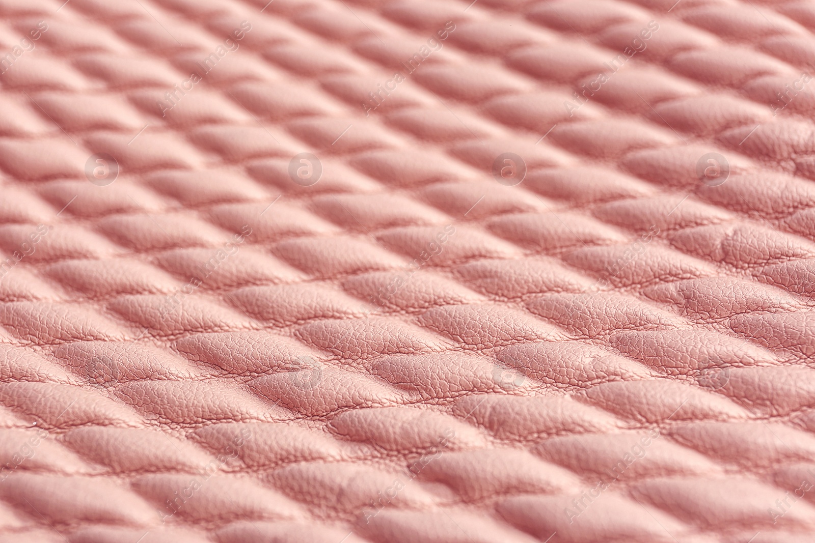 Photo of Texture of rose gold leather as background