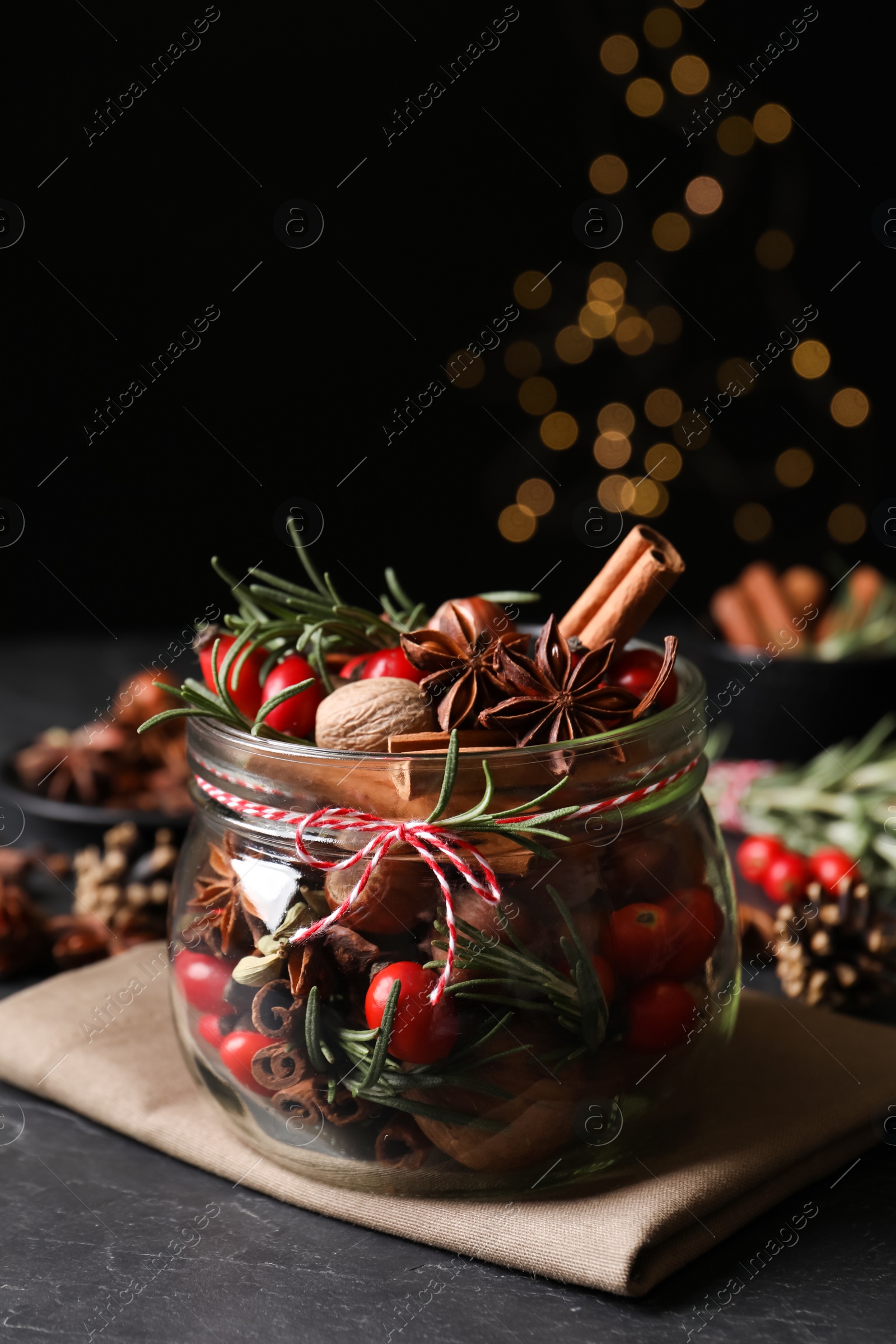 Photo of Aroma potpourri with different spices on black table