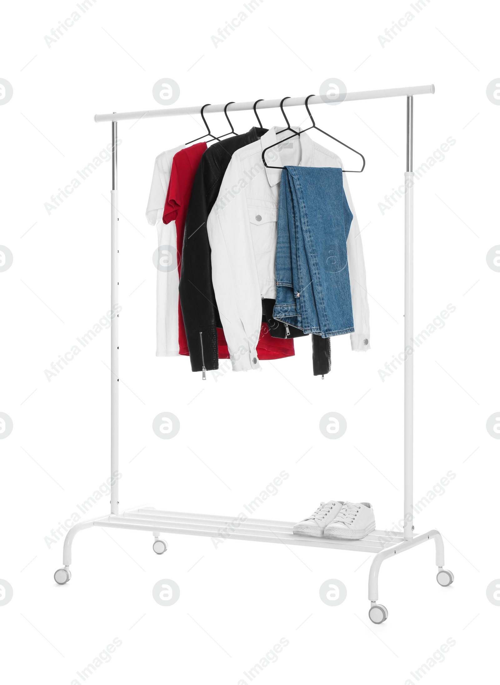 Photo of Rack with stylish women's clothes isolated on white