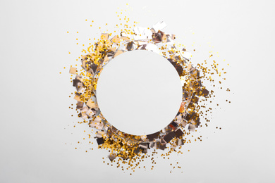 Photo of Flat lay composition with confetti on white background. Space for text