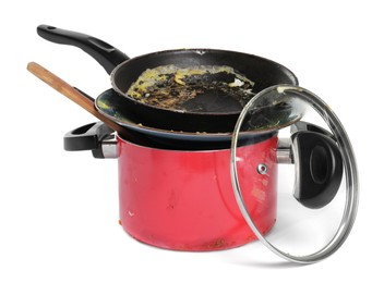 Stack of dirty kitchenware on white background