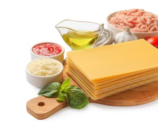 Photo of Uncooked ingredients for lasagna isolated on white