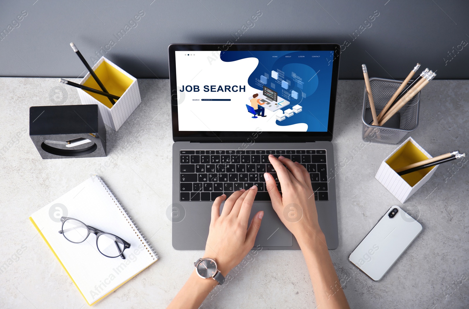 Image of Woman working with modern laptop at grey table, top view. Job search