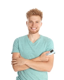Photo of Young man with air conditioner remote on white background