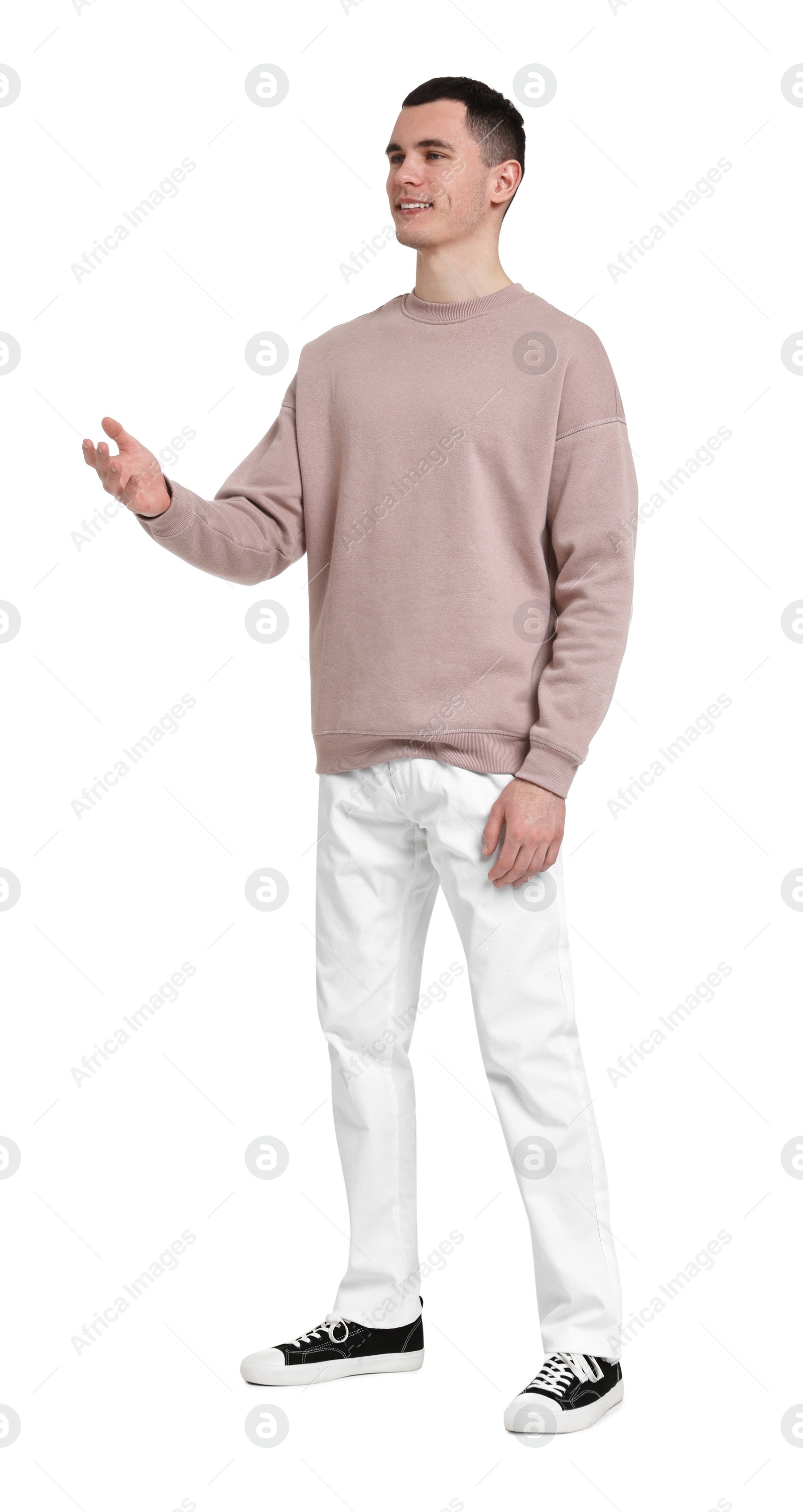 Photo of Handsome young man greeting someone on white background