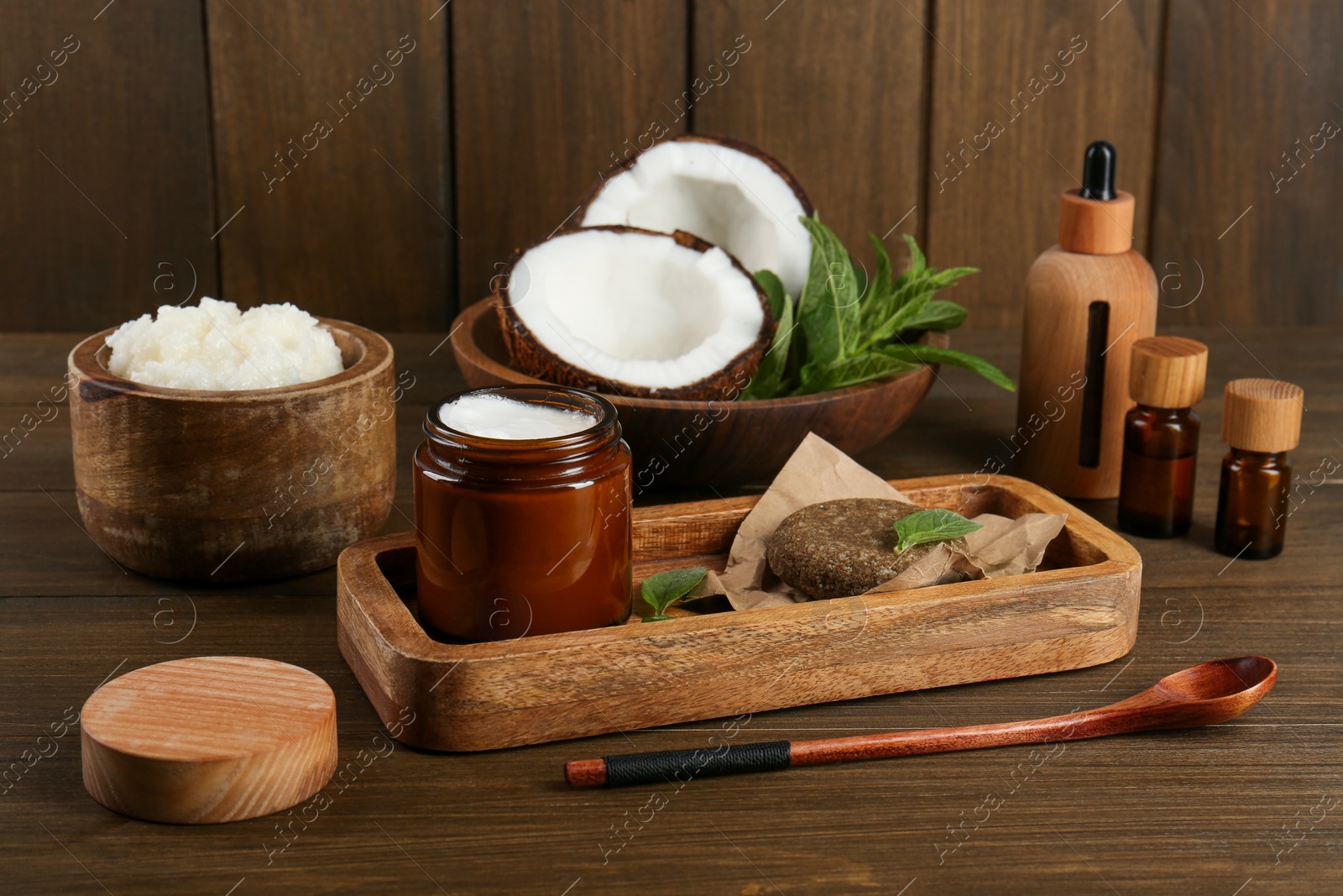 Photo of Homemade cosmetic products and fresh ingredients on wooden table