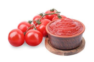 Photo of Organic ketchup in bowl and fresh tomatoes isolated on white. Tomato sauce
