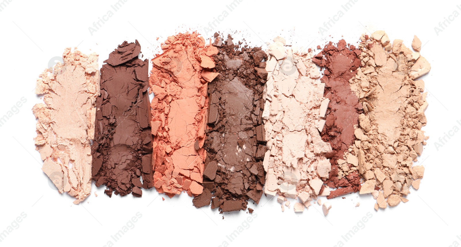 Photo of Crushed eye shadows on white background, top view. Professional makeup product