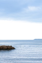 Photo of Beautiful view on sea with rock breakwater