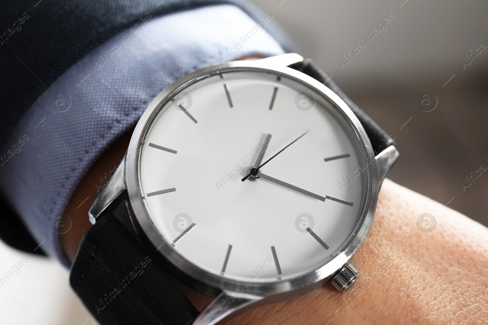 Photo of Businessman with stylish wrist watch, closeup. Time management