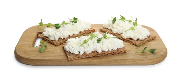 Photo of Crispy crackers with cottage cheese and microgreens on white background