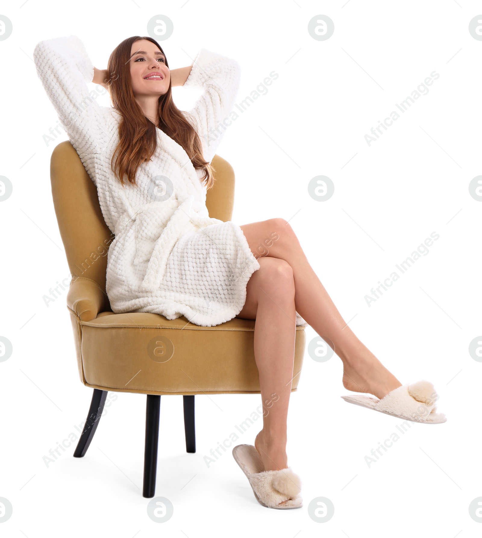 Photo of Young woman in bathrobe on white background