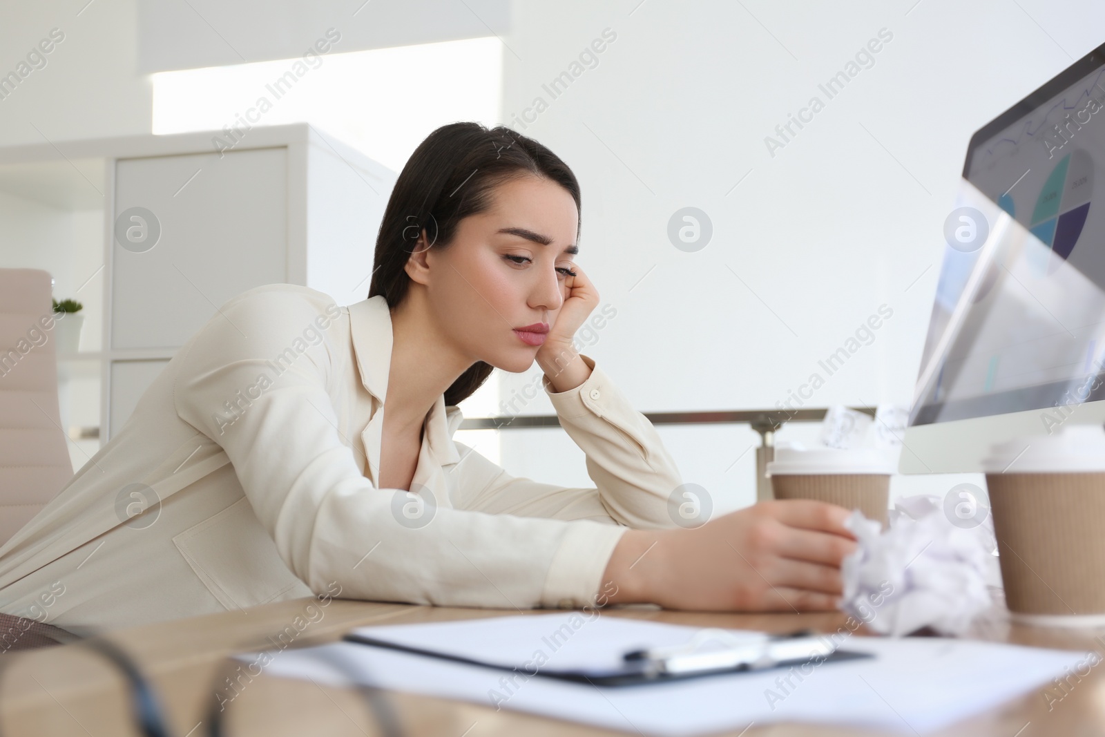 Photo of Businesswoman stressing out at workplace in office