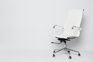 Photo of Comfortable office chair on white background, space for text