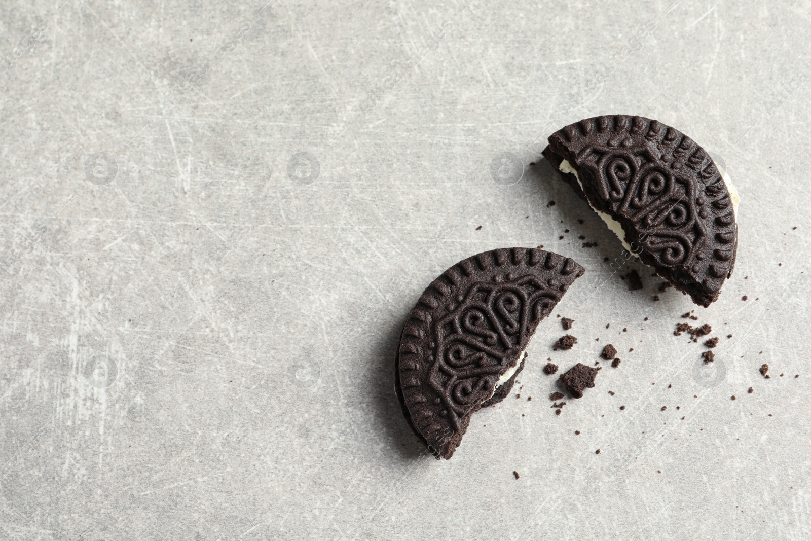 Photo of Tasty chocolate cookies on grey background, top view with space for text