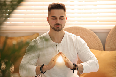 Young man during self-healing session in therapy room