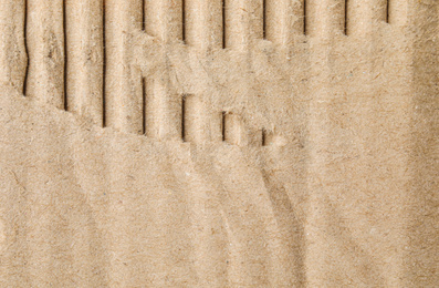 Photo of Torn sheet of cardboard as background, closeup
