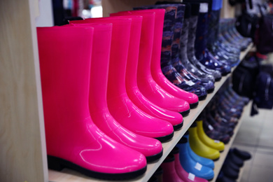 Photo of Many colorful gum boots at wholesale market