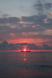 Picturesque view of sunset with clouds over sea