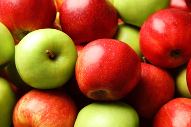 Photo of Many different ripe apples as background, closeup