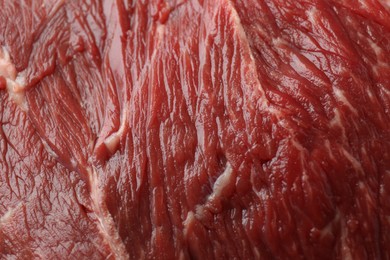 Texture of fresh beef meat as background, closeup