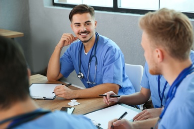 Photo of Medical students in uniforms studying at university