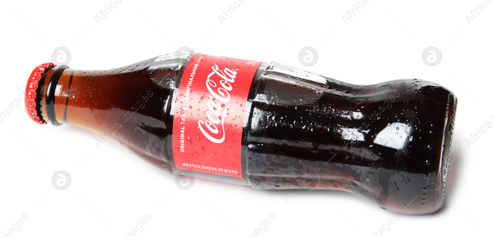 Photo of MYKOLAIV, UKRAINE - NOVEMBER 15, 2018: Glass bottle of Coca Cola on white background