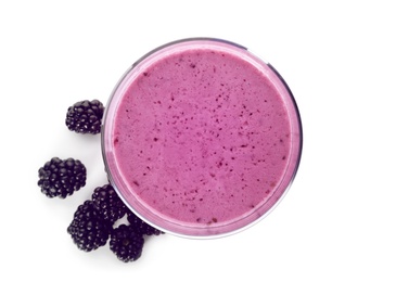 Photo of Glass with blackberry yogurt smoothie on white background, top view