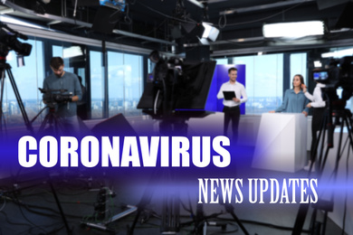Image of Presenters and video camera operator working in studio. Coronavirus pandemic - latest updates