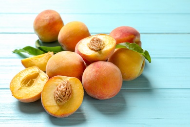 Photo of Fresh sweet peaches on wooden table