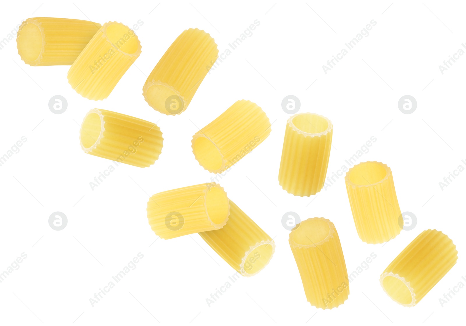 Image of Raw rigatoni pasta falling on white background