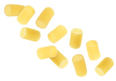 Image of Raw rigatoni pasta falling on white background