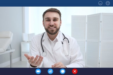 Pediatrician consulting patient online using video chat in clinic, view from webcam