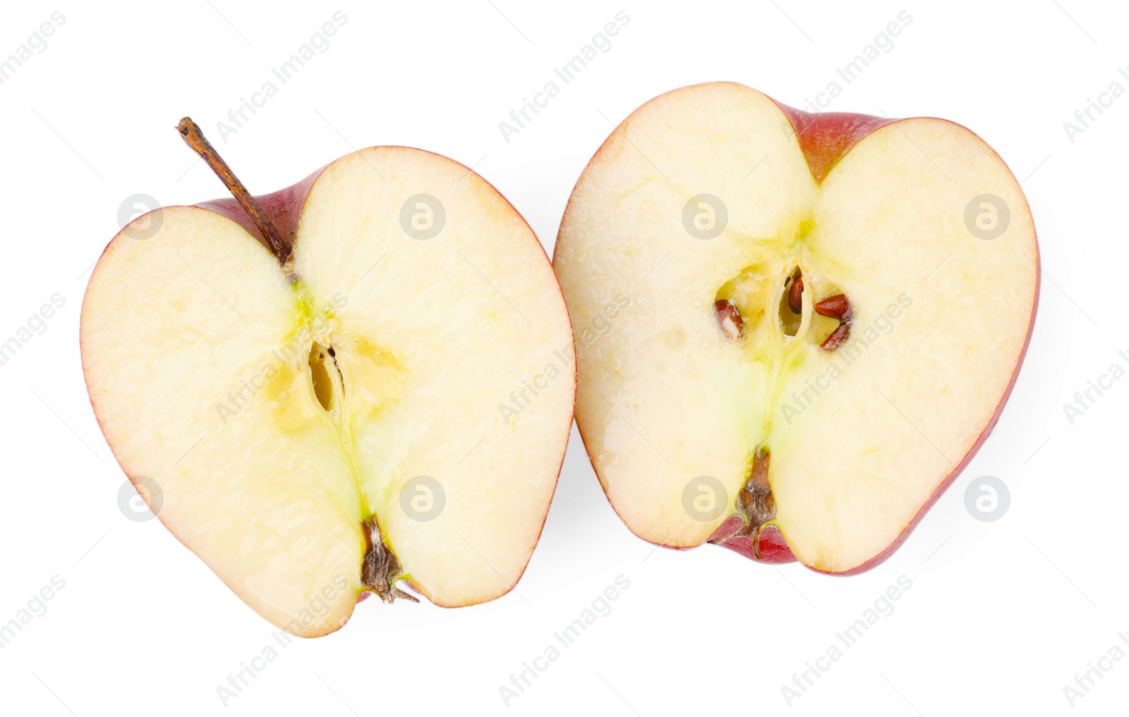 Photo of Halves of ripe red apple on white background, top view