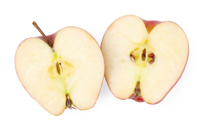 Photo of Halves of ripe red apple on white background, top view