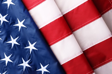 Folded American flag as background, top view