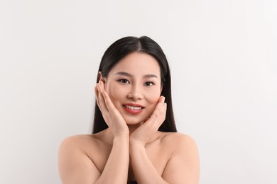 Portrait of beautiful woman on white background