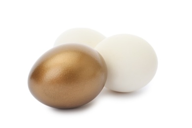 Photo of Golden egg among ordinary ones on white background