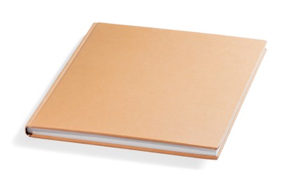 Photo of One closed beige hardcover book isolated on white