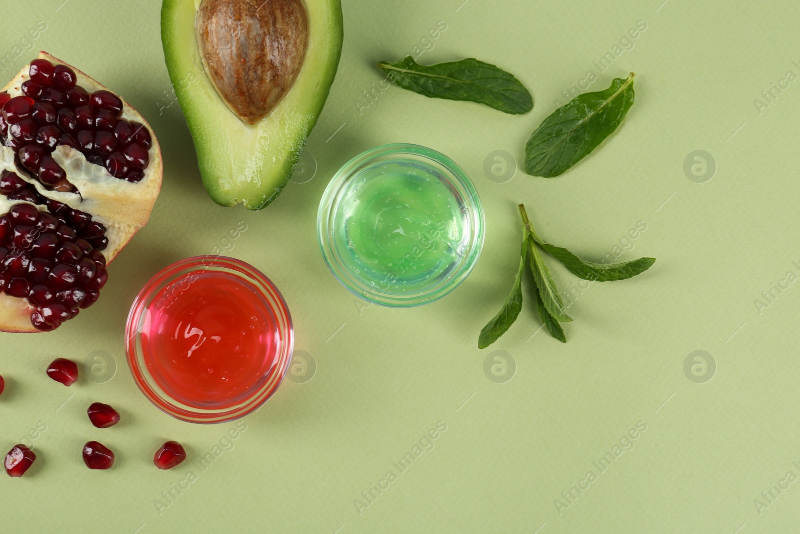 Photo of Flat lay composition with homemade cosmetic products and fresh ingredients on light green background, space for text. DIY beauty recipe