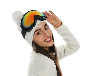 Photo of Woman wearing fleece jacket, hat and goggles on white background. Winter sport clothes