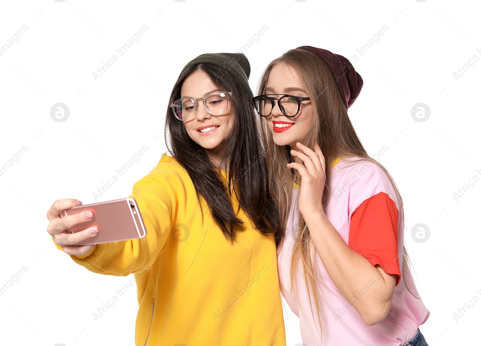 Photo of Attractive young women taking selfie on white background