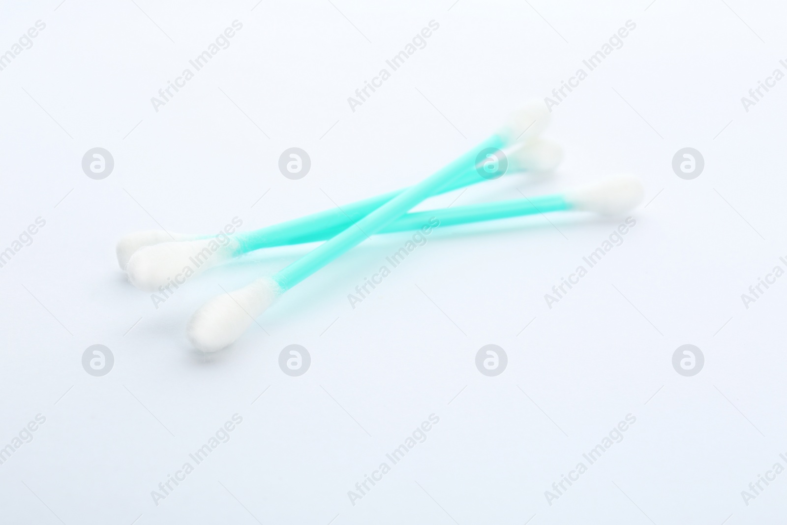 Photo of Plastic cotton swabs on white background. Hygienic accessory