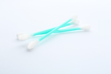 Photo of Plastic cotton swabs on white background. Hygienic accessory