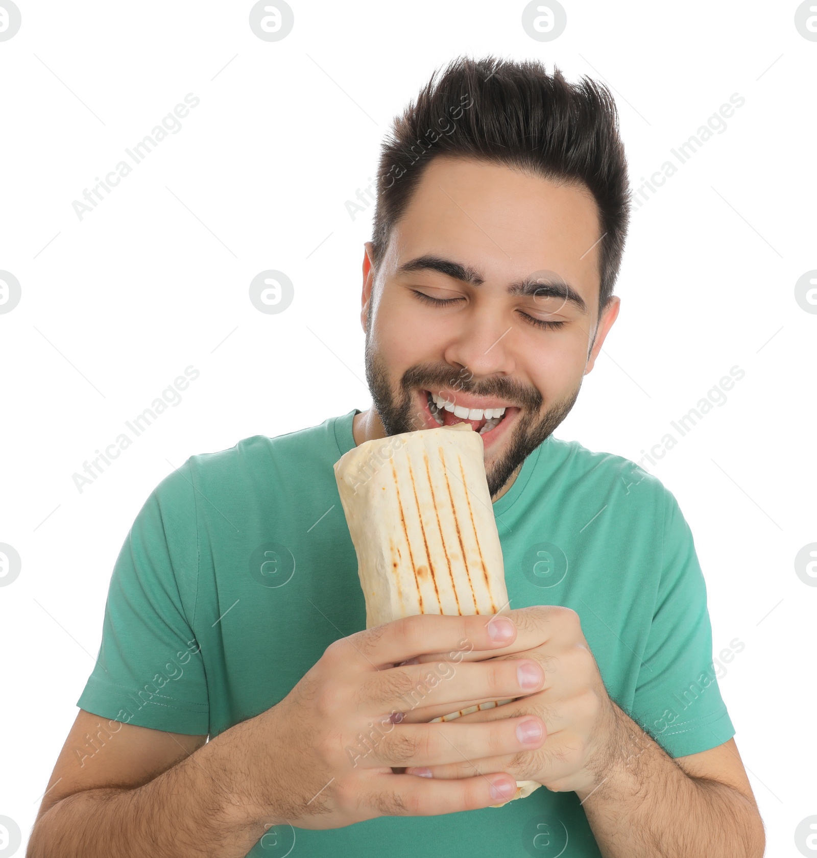 Photo of Young man eating tasty shawarma isolated on white