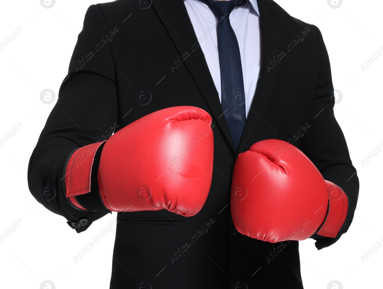 Photo of Businessman in suit wearing boxing gloves on white background, closeup