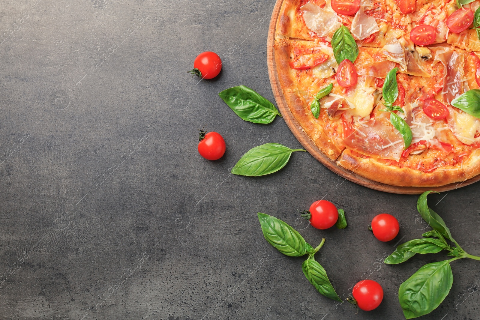 Photo of Delicious pizza with tomatoes and meat on table, top view